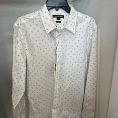 Slim Fit Elevate Your Summer Wardrobe With This Classic Michael Kors Button-Up Shirt. The Crisp White Color And Long Sleeves Make It Perfect For Any Occasion. The Shirt Is Made For Men Who Appreciate Style And Comfort, With A Size Of Large That Fits Perfectly For Regular Size Types. The Shirt Is Made Of High-Quality Materials That Ensure Durability And Comfort. The Shirt Is Suitable For All Types Of Summer Activities, From Casual Outings To Special Events. The Michael Kors Brand Is Known For Its Designer Printed White Shirt, Designer White Printed Shirt, Michael Kors Cotton Tops For Spring, Michael Kors Casual Tops For Work, Formal White Printed Tops, Solid Dress Shirt, Michael Kors Men, Plaid Dress Shirt, Button Up Long Sleeve