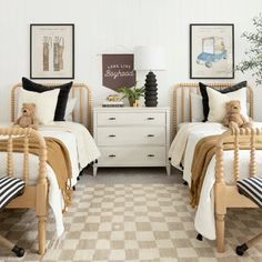 two twin beds with teddy bears on them in a bedroom