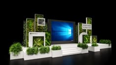 an image of a display with plants and windows on the wall in front of it