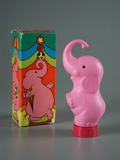 an elephant figurine next to a box