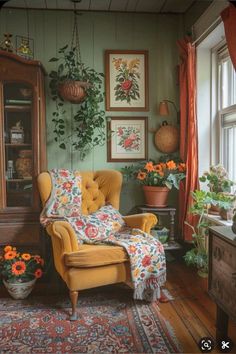 a living room filled with lots of furniture and flowers on the wall next to a window