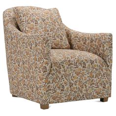 an upholstered chair with floral fabric