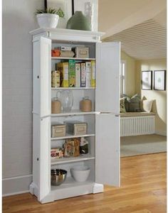 a white refrigerator freezer sitting inside of a kitchen