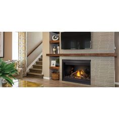 a living room with a fire place and tv on the wall next to a stair case