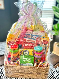 a basket filled with candy and snacks on top of a table