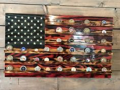 an american flag made out of wooden planks with buttons on the bottom and sides