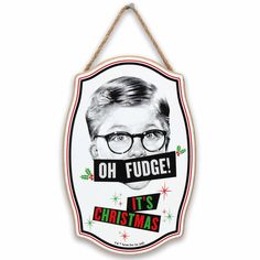 a sign that says oh fudge it's christmas hanging from a rope on the wall