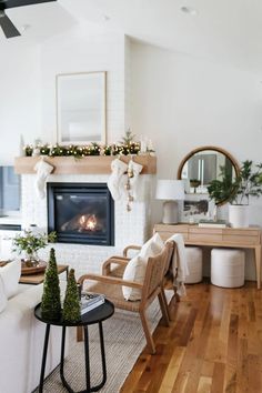 a living room filled with furniture and a fire place in the middle of the room