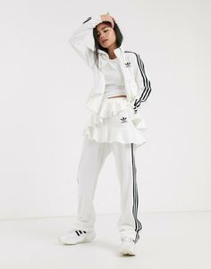 Regular fit is not tight and not loose, the perfect in-between fit Open hems 79% cotton / 21% recycled polyester velour Side zip pocket; Elastic waist Double-layer satin frill Cute Workout Outfits, Ruffle Pants, Jogging Suit, Track Pant, Pants White, Active Wear Pants, White Skirt, Adidas Pants, White Adidas