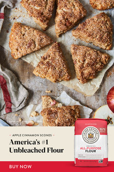 an advertisement for apple cinnamon scones on a table with apples and other food items