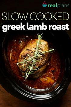 slow cooked greek lamb roast in a slow cooker with rosemary garnish on top