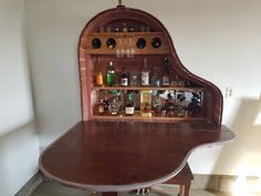 an old fashioned bar with liquor bottles on it