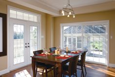 the dining room table is set with place settings