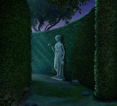 a statue in the middle of a garden surrounded by trees and bushes at night time