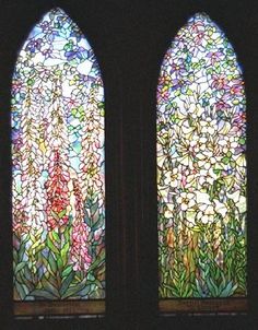 two stained glass windows with flowers in them