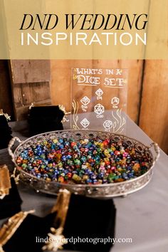 a table topped with lots of different colored candies next to a sign that says, wedding inspiration