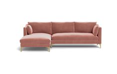 a pink couch with a chaise lounger on the left and an ottoman on the right