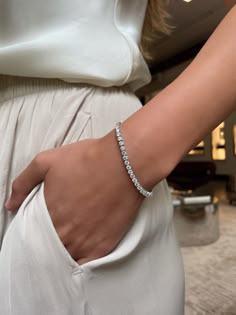 This tennis bracelet is prong set with 54 round brilliant cut diamonds, weighing approximately 0.15 carats each. Bracelet Tennis, Classic Bracelets, Diamond Tennis Bracelet, Gold Bracelet For Women, Gold Bracelets, Classy Jewelry, Jewelry Lookbook, Tennis Bracelet Diamond, Bracelets For Women