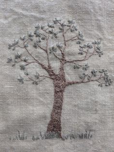 a close up of a tree on a piece of cloth