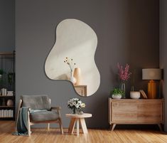 a living room with grey walls and wooden floors