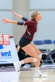 a female volleyball player in action on the court