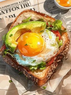 a sandwich with an egg and avocado on it