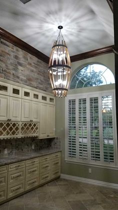 a light fixture hanging from the ceiling in a kitchen