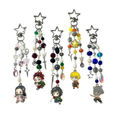 several key chains with anime characters hanging from it's ends and charms attached to them