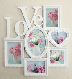 a wall hanging with pictures and flowers on it's side, in the shape of a heart