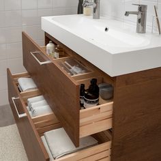 a bathroom sink with drawers underneath it