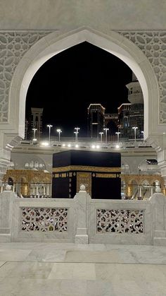 the view from inside an ornate building at night