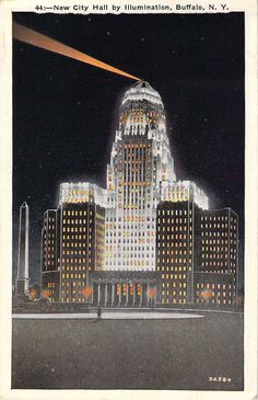 an old postcard shows the building lit up in white and yellow lights at night