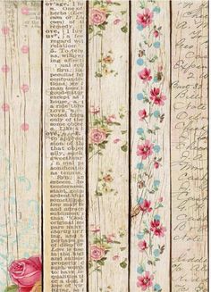 an old wooden wall with flowers and writing on the wood planks that have been painted white