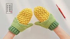 two hands wearing knitted mittens with green and yellow gloves on top of each other