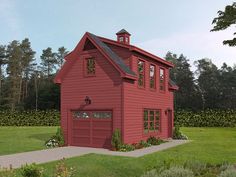 a large red house with two windows and a garage