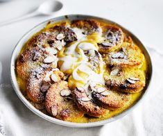 a bowl filled with food on top of a white table