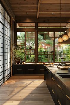 a kitchen with lots of windows and wooden flooring