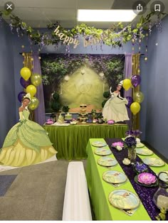 a table set up for a princess and the frog birthday party