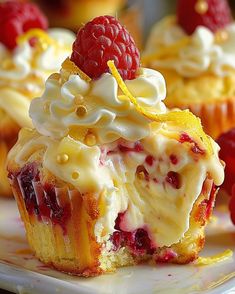 raspberry and lemon cupcakes on a white plate