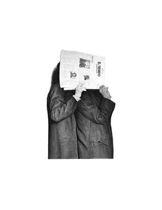 a man holding up a newspaper to his face