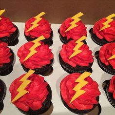 cupcakes with red frosting and yellow lightning bolt decorations