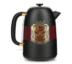 the hogwarts house coffee pot is black with gold trim and features a red stripe