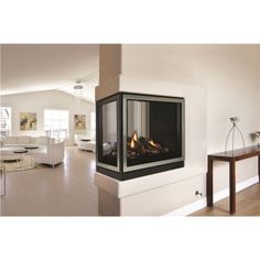 a living room filled with furniture and a fire place next to a wall mounted fireplace