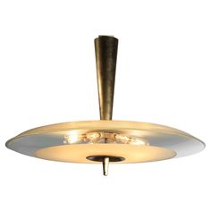 a brass ceiling light with three lights on it