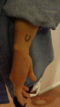 a person with a small tattoo on their foot