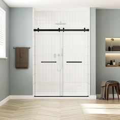 a bathroom with a walk in shower next to a wooden stool and white tiled walls