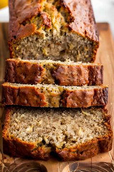 sliced loaf of banana bread sitting on top of a cutting board