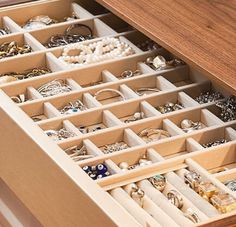 the drawers are filled with jewelry and bracelets