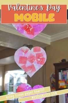 valentine's day mobile for kids using tissue paper hearts to make them look like they are