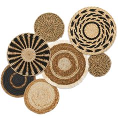 several woven baskets with black and white designs on the bottom one is round, two are oval